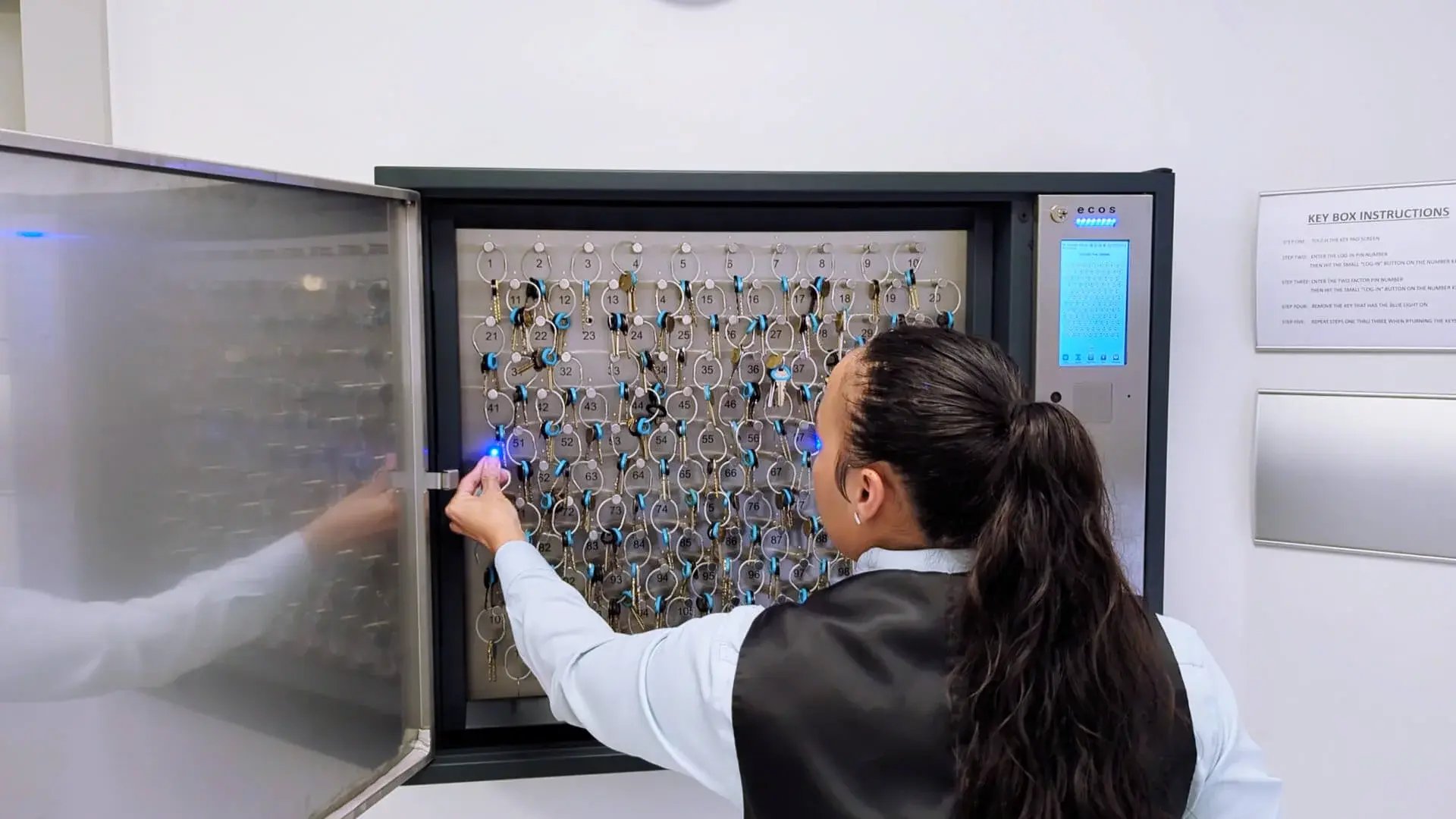 ecos_key_120_staff_using_key_cab_at_corniche_condo_US